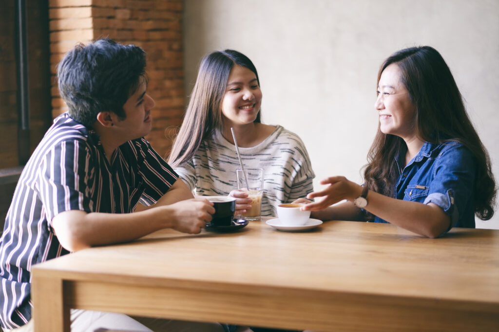 Asian parents talking to a counselor about Hwa Chong math tuition