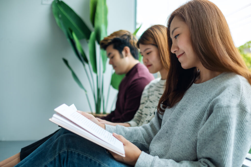 Young adults reviewing their notes indoors