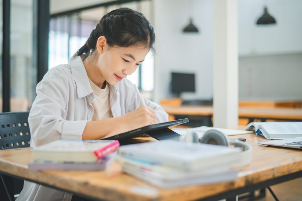 Young teen studying at her tuition centre